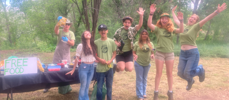 Youth Conservation Corps members jump for joy because they love being employed at Taos Land Trust