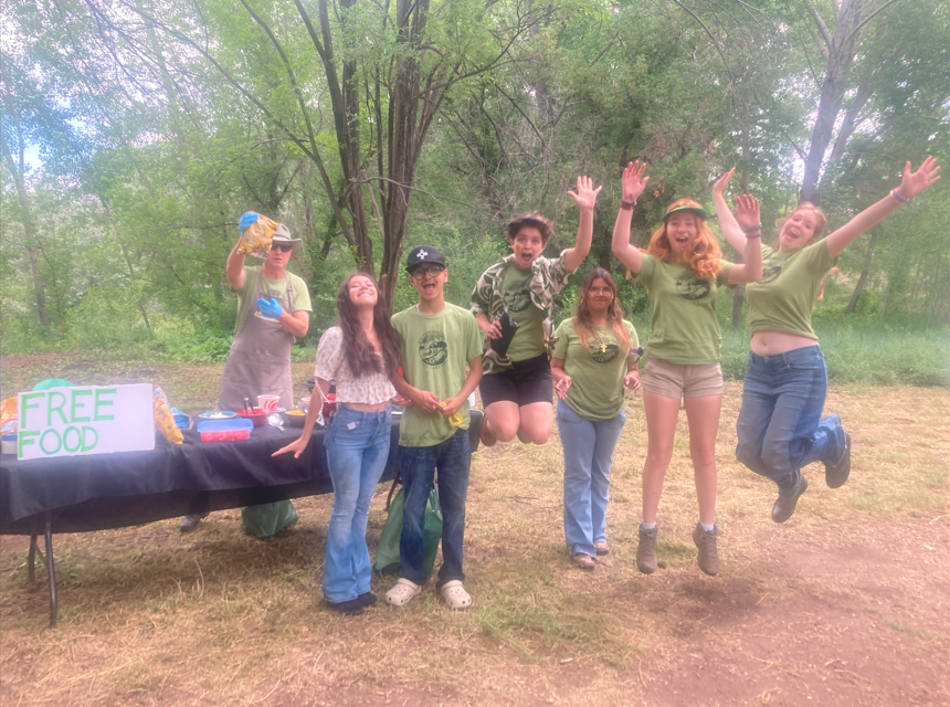 Youth Conservation Corps members jump for joy because they love being employed at Taos Land Trust